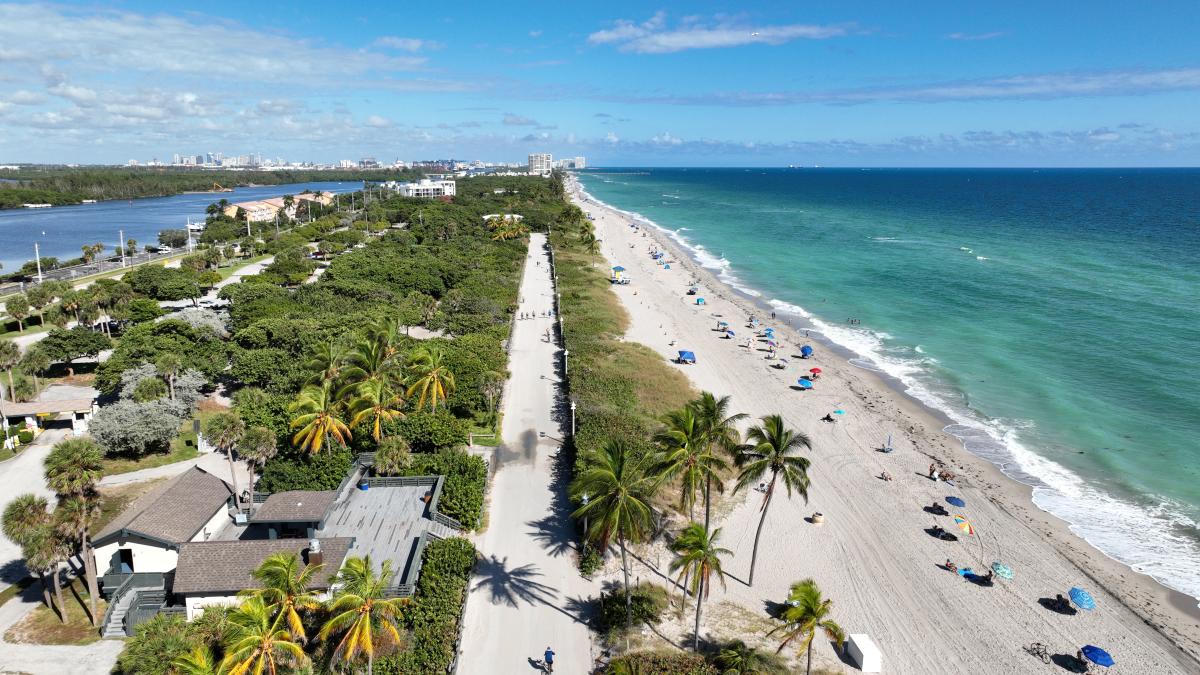 Aerial view of a beach promenade beside the ocean