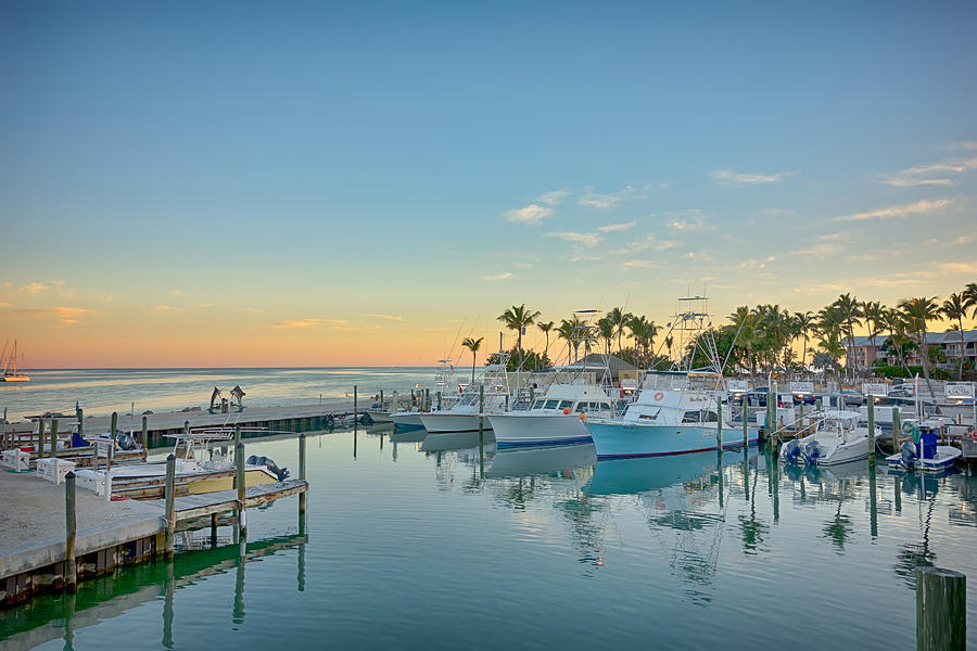 Fishing boats docked in a Florida Keys marina at dusk